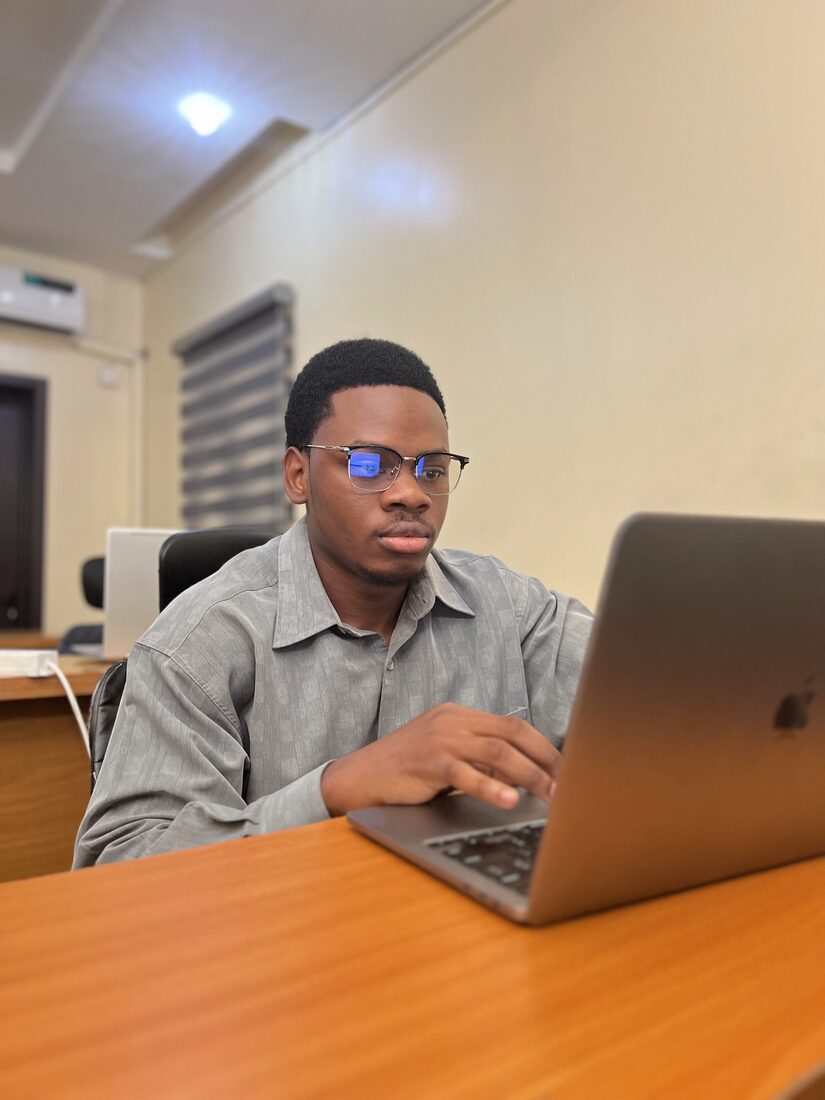 A learner writing code during a Full Stack class