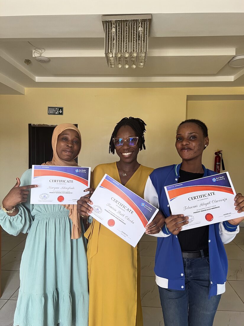 Graduates with their certificates