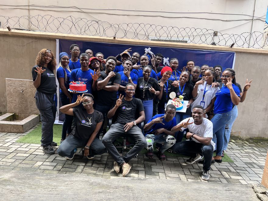 A full cohort of Tech Studio Academy students celebrating together with their instructors